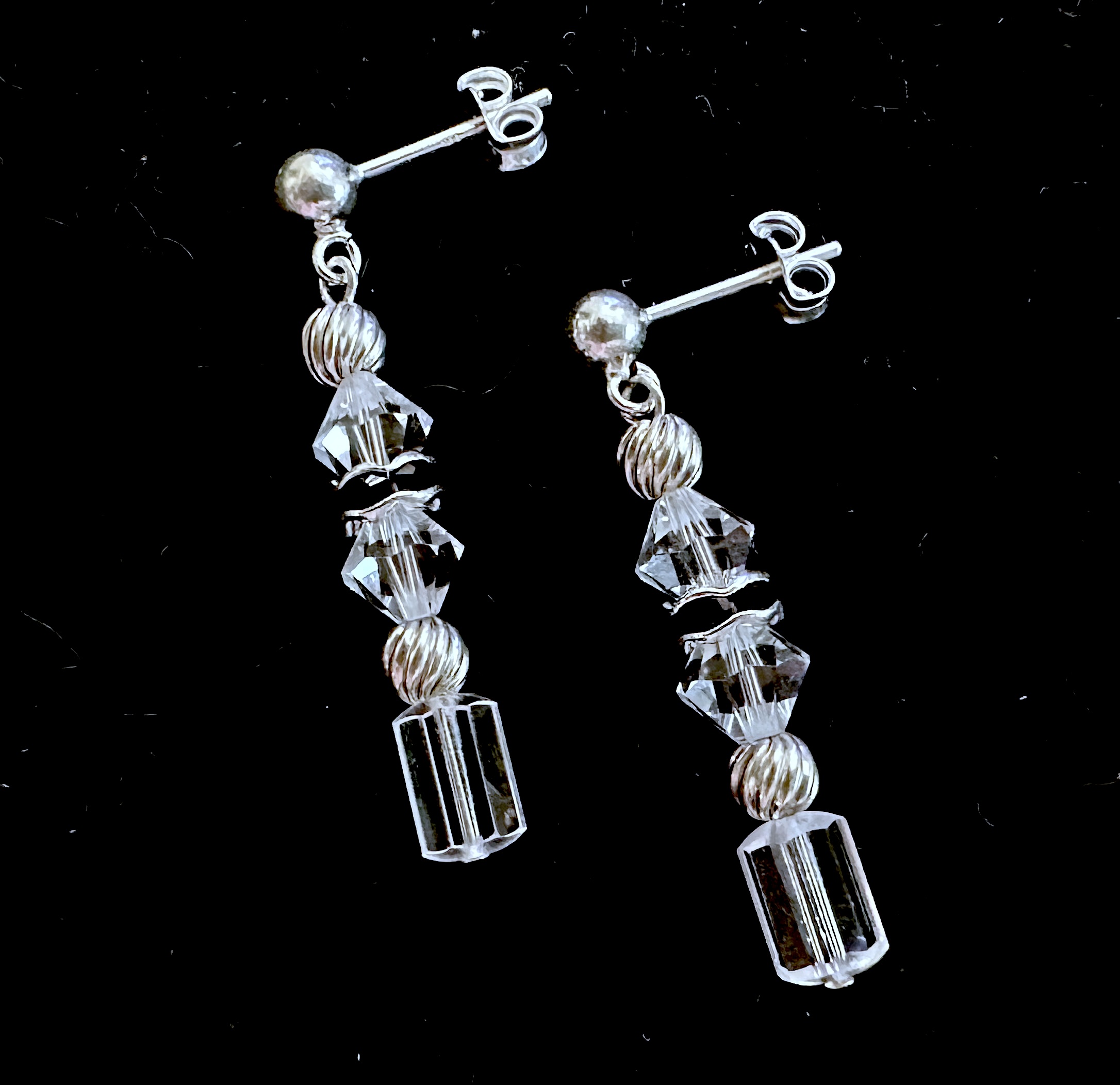 Earrings on black background