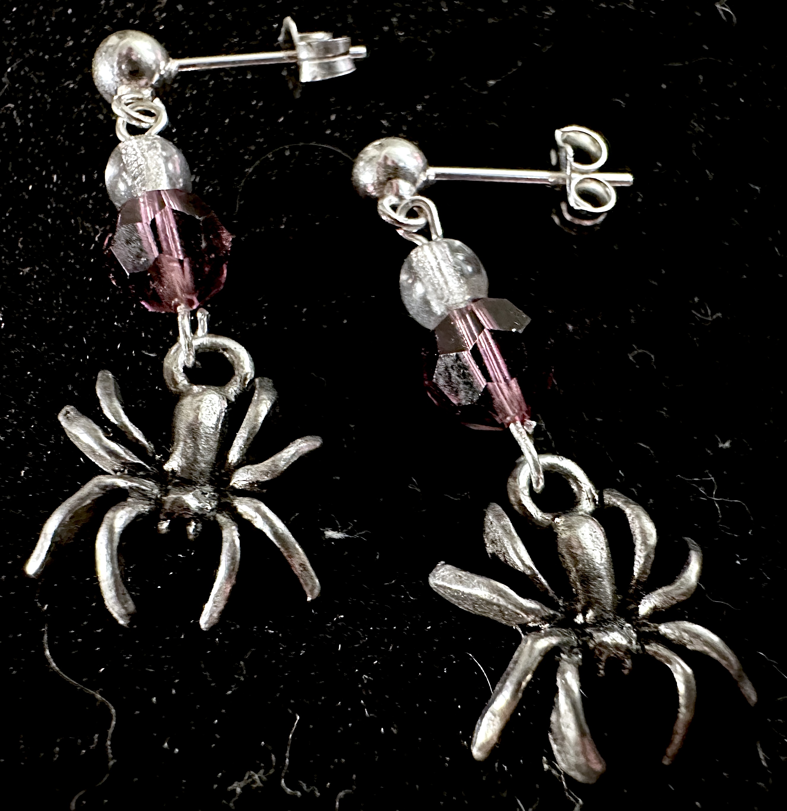 Earrings on black background