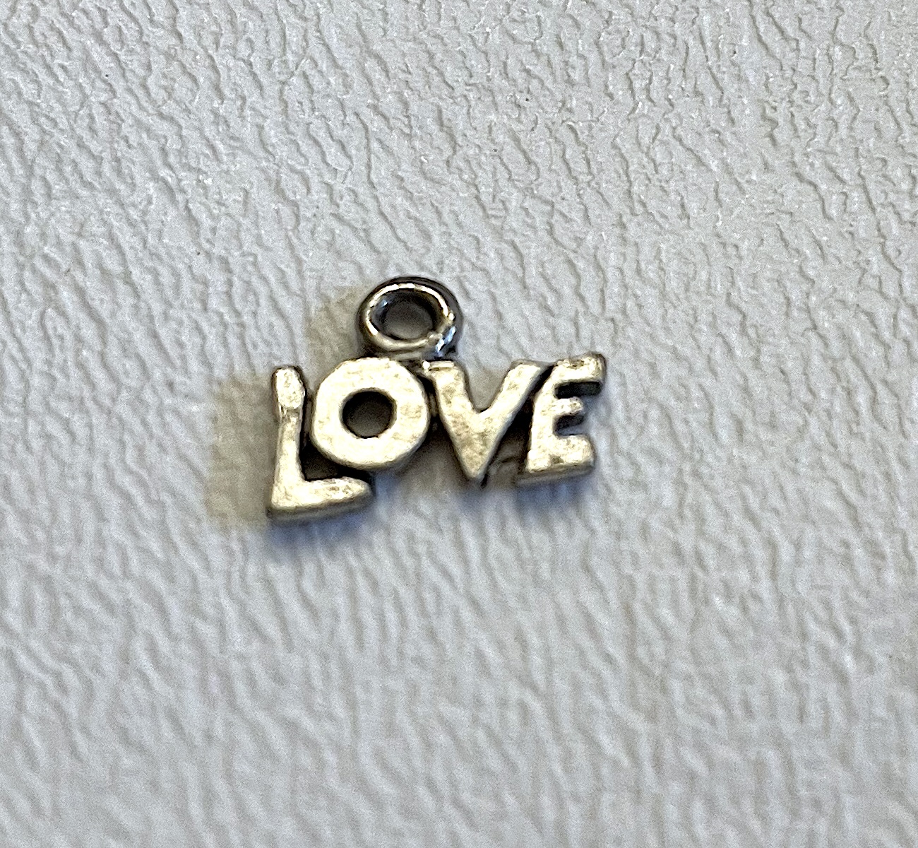 Charm on white background